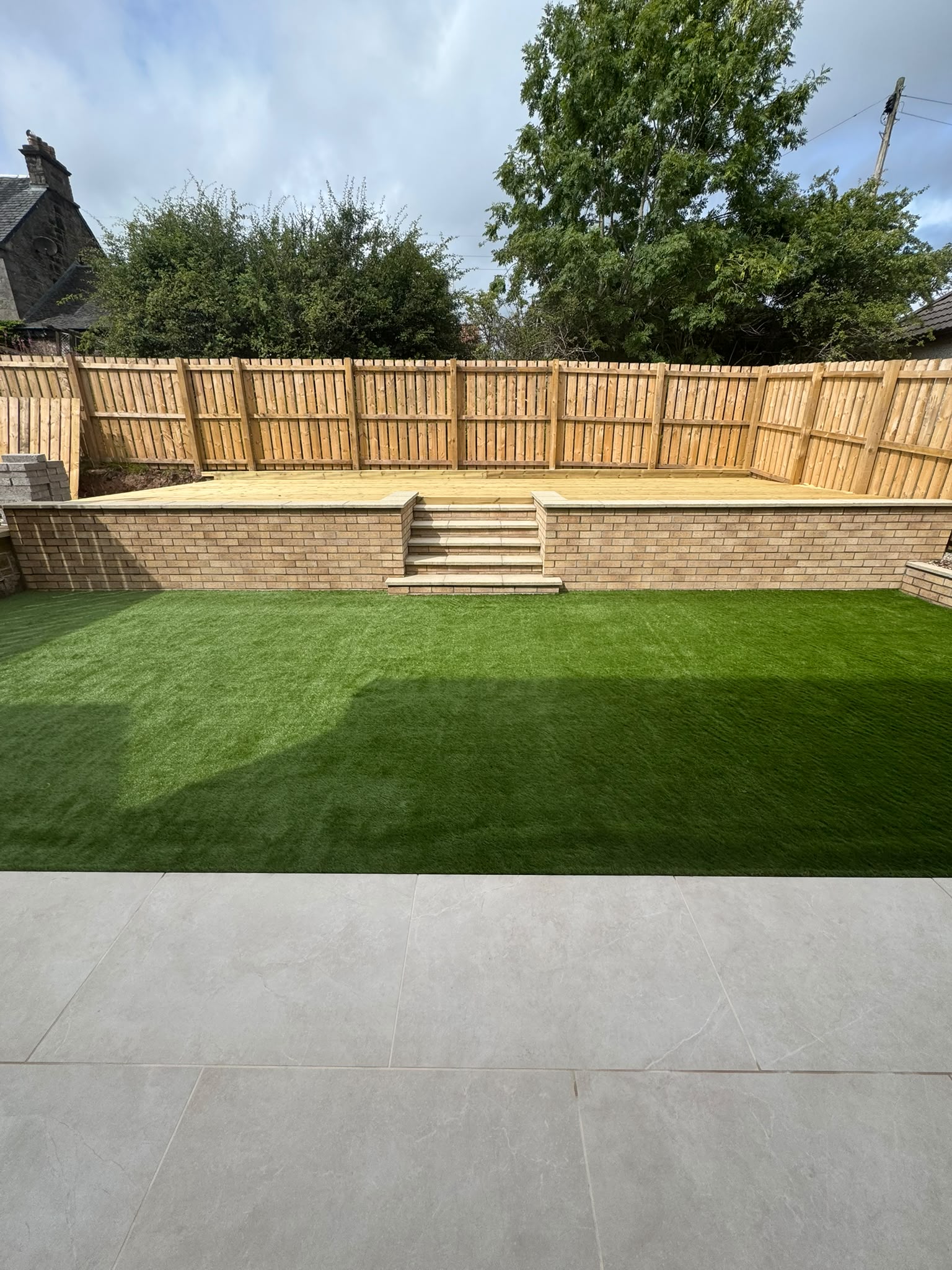 Multi-Tier Brick Steps, Artificial Turf & Fencing